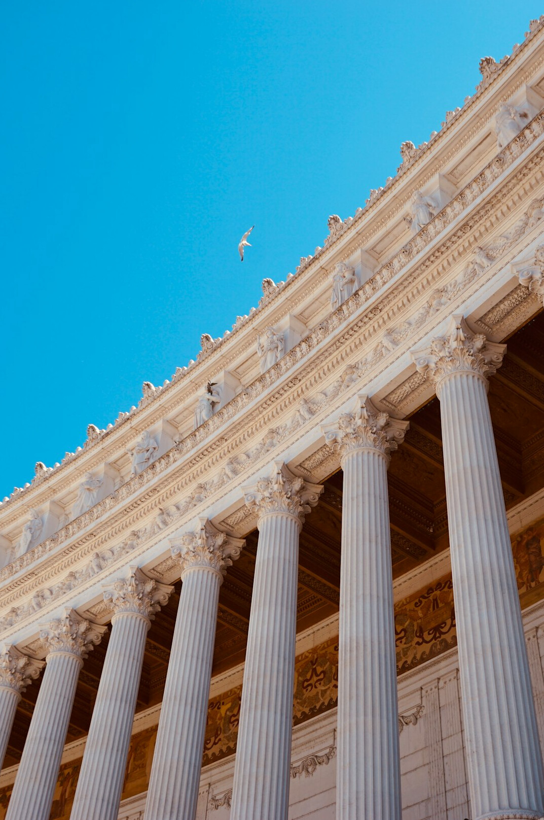 Classical government building facade with columns under a clear sky